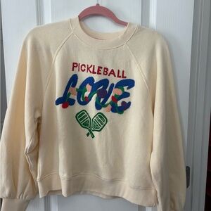 Cream colored “pickleball love” sweatshirt by Just Madison